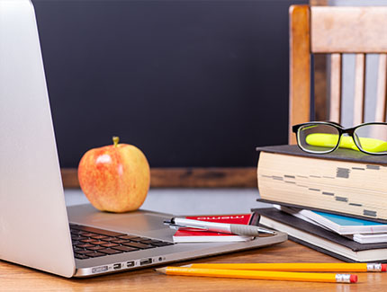 Desktop with open book and keyboard